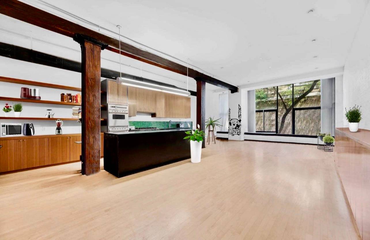 Rare Thompson street 2400 SF open format loft with a 500 SF private back yard oasis.