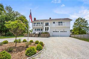 Steps to miles of sandy beaches, breath taking water views, newly remodeled to perfection, and set on an oversized and level.