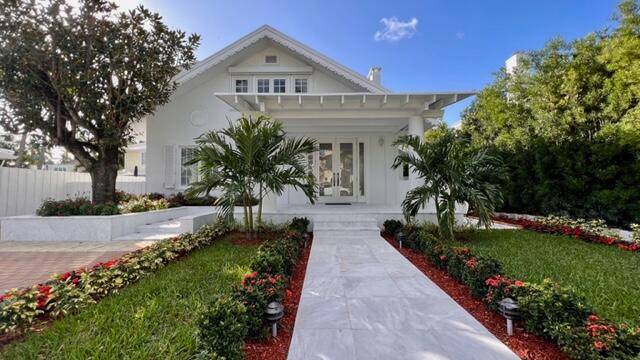 Elegant craftsman style Palm Beach cottage perfectly updated and beautifully decorated.