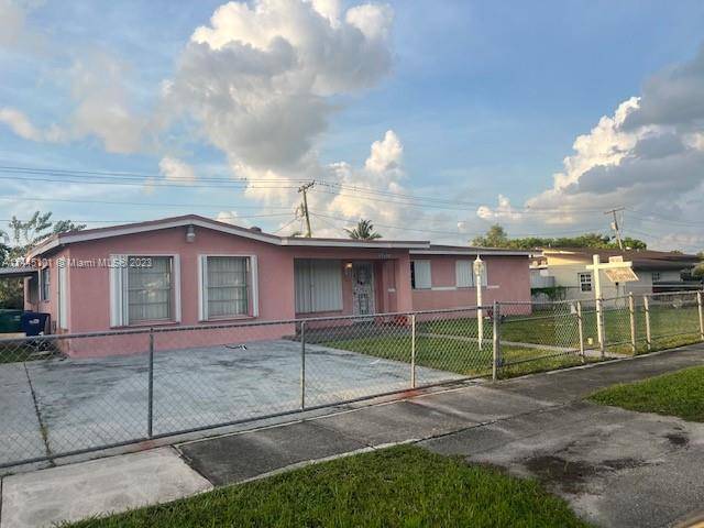 Beautiful Miami Gardens Home feature Four bedroom three baths with oversized family room, oversized living room, extra room could be fifth bedroom or office, has a large detached storage room.