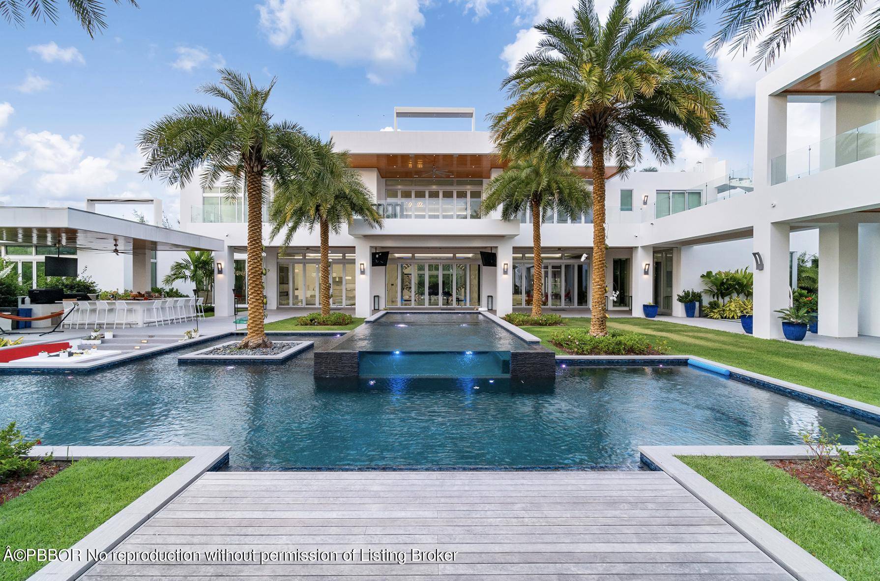 This contemporary masterpiece is comprised of nearly 2 acres of paradise in the highly sought after enclave of Seminole Landing.