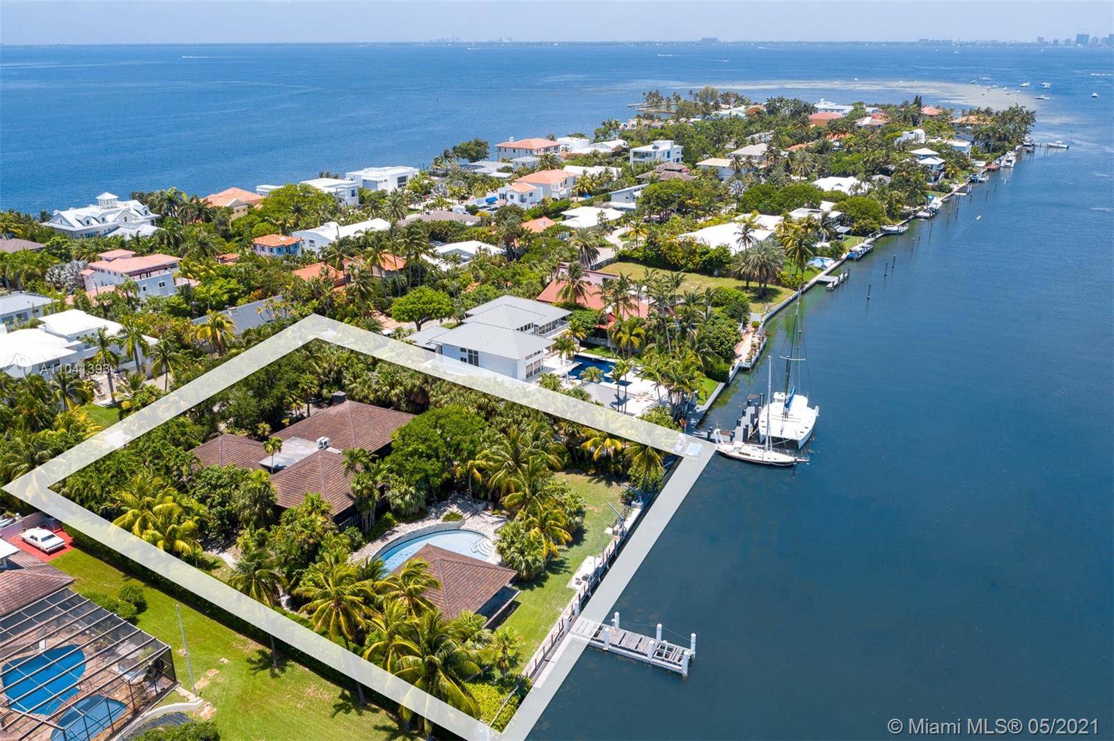 Yachtman's paradise ! Unique and rare opportunity to own one of the most sought after double plus lots on wide bodied Hurricane Harbour.