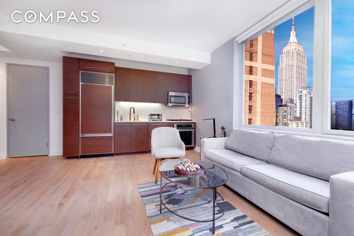 Bright cheerful elegant studio with a SPECTACULAR view of the Empire State Building through floor to ceiling windows.