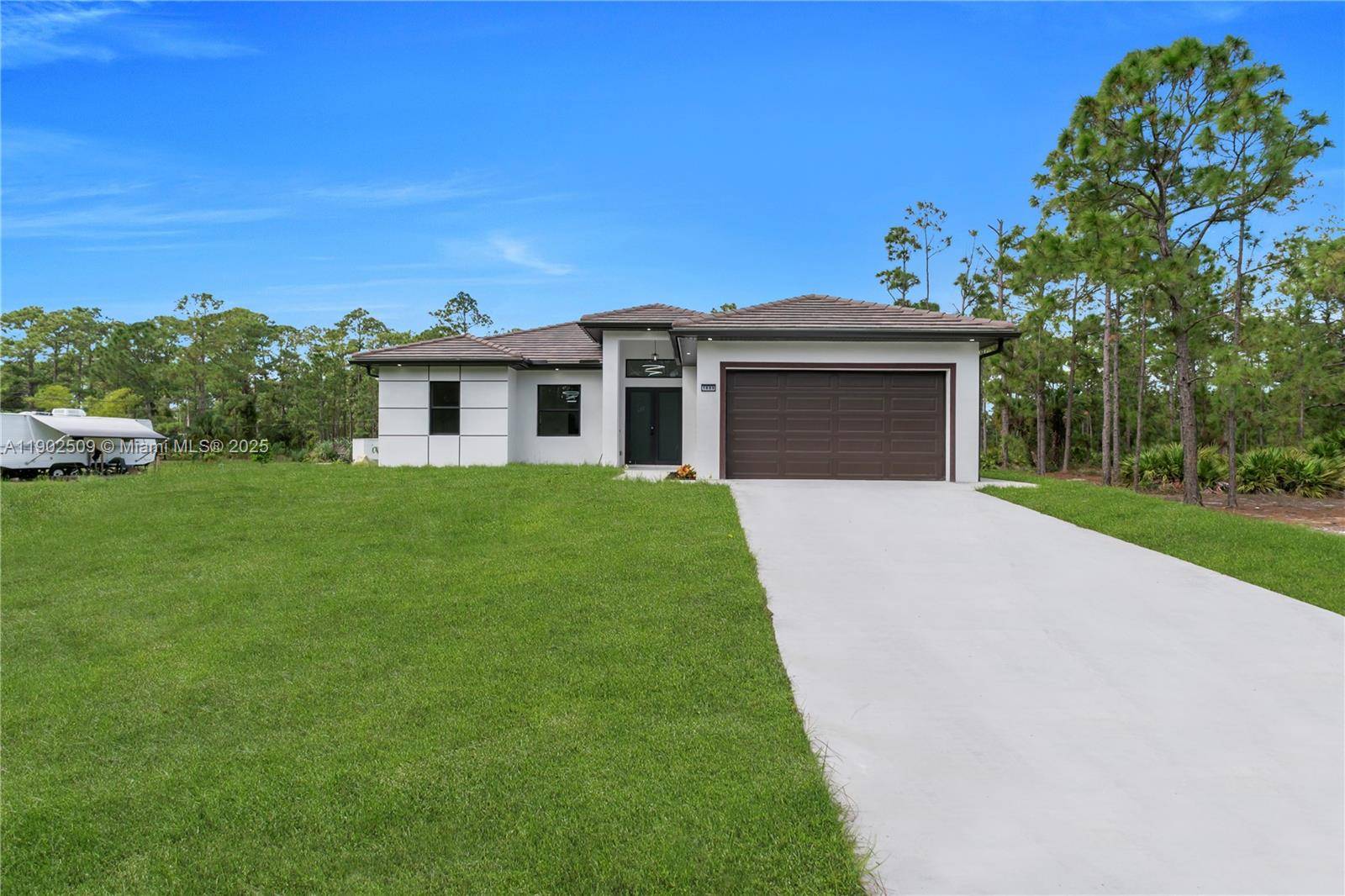 Welcome to this stunning home sitting on a spacious 1 2 acre lot in Lehigh Acres.
