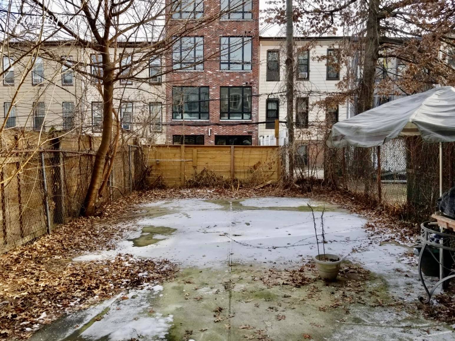 Ideal garden apartment w study office and PRIVATE 800 sf backyard in a Bushwick 3 family townhouse.