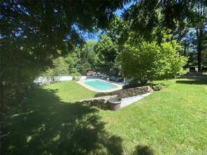 Family retreat with in ground pool and outdoor entertaining and cooking area is available for your summer getaway.
