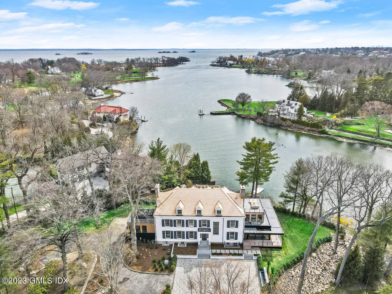Capturing magnificent light and striking water vistas, this resort like aerie sits high above Indian Harbor on 292' of private water frontage with a waterside entertaining deck, boathouse and floating ...