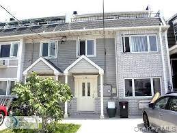 Coastal 2 Family Gem with Ocean Views amp ; Income Potential.