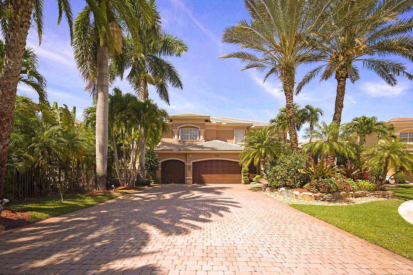 Welcome to this exquisite waterfront pool home situated on a serene cul de sac with an expansive driveway.