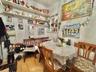 Dining room with light wood finished floors and crown molding