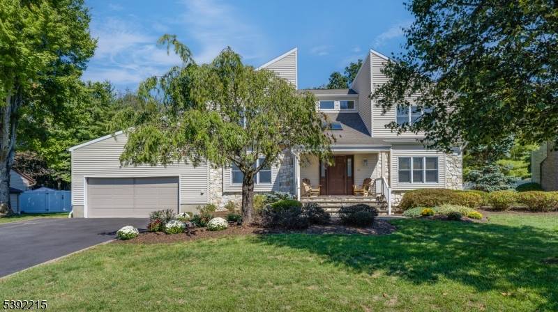 ENTERTAINER'S PARADISE NESTLED IN THE HEART OF FLORHAM PARK W STUNNING POOL AND PRIMARY SUITES ON BOTH THE FIRST AND SECOND FLOOR !