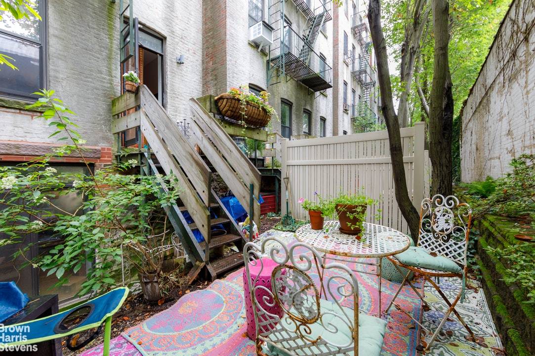 Tucked away on a beautiful Place block in the heart of Park Slope, this light, bright garden apartment is an oasis of quiet.