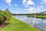 Serene pond frontage with wide-open water views.
