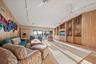 LIVING ROOM - wrought with cypress walls, 12 ft ceilings, sliders that open to the gulf...