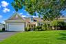 Welcoming front exterior with mature plantings
