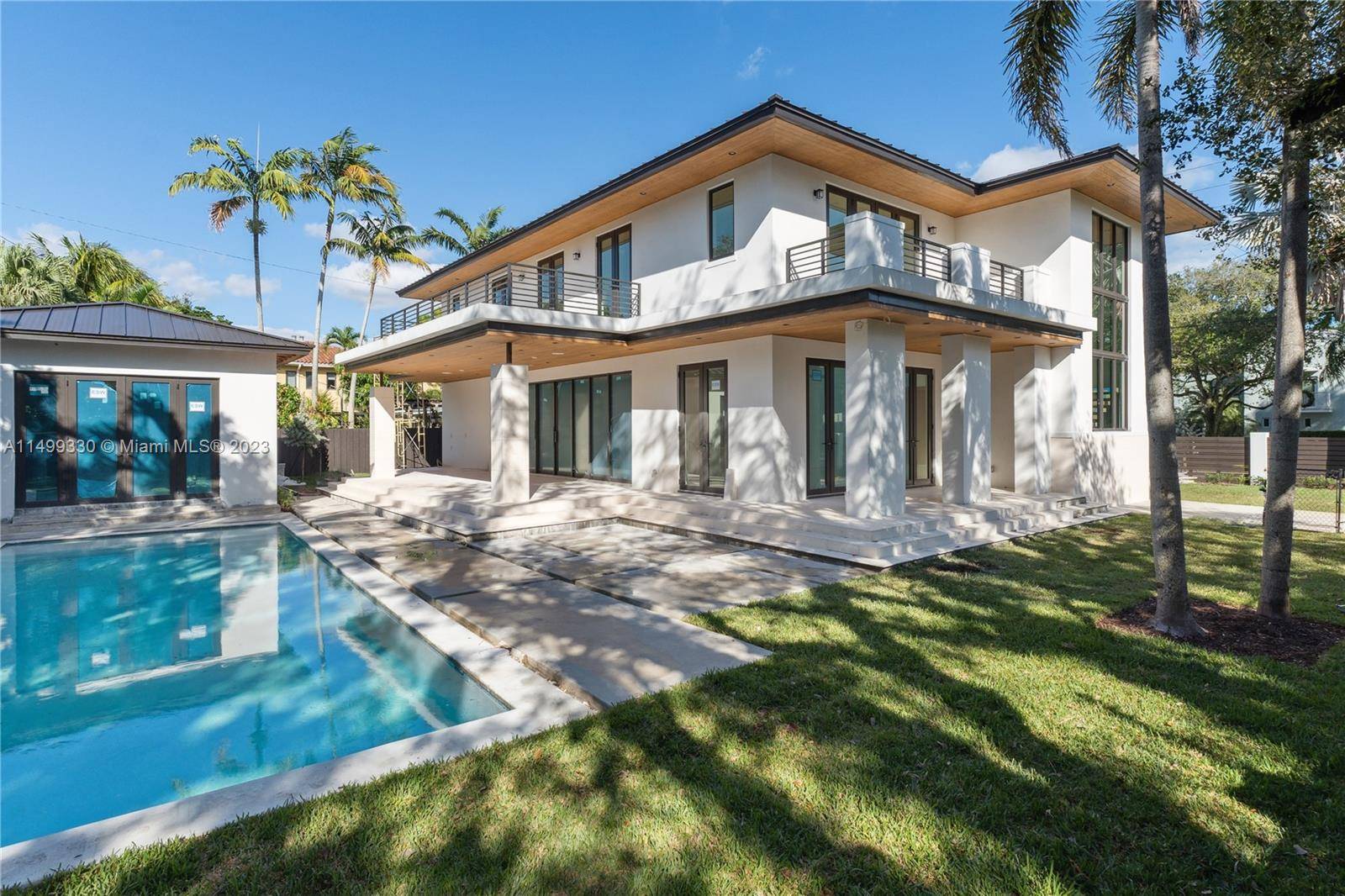 New construction contemporary masterpiece, perfectly positioned on a corner lot facing a tree lined pedestrian friendly street.