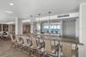 The Club Room offers a full kitchen, seating abd dining areas, a library and game area.