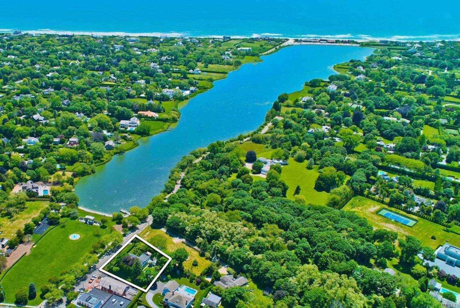 Located south of the highway in the heart of the Southampton Village estate section, an exceptionally appointed Hamptons retreat awaits with spectacular views of Lake Agawam and Agawam Park.