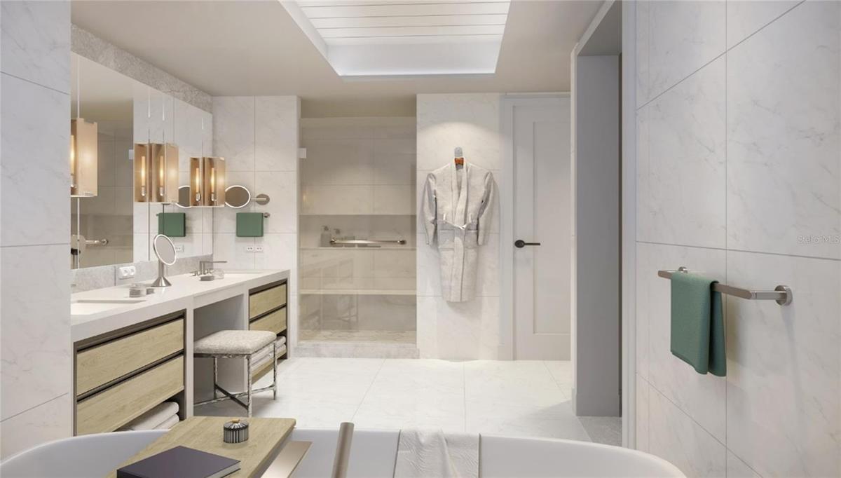 Artist Rendering. Luxurious primary bath featuring custom vanities, marble floors, walls and shower and lavish freestanding soaking tub.