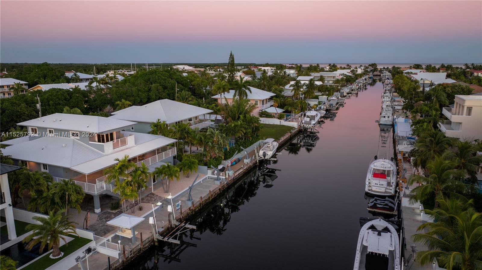 Welcome to the epitome of waterfront luxury living in prestigious Port Largo, offering 75 ft of concrete dock w a 15, 000 lbs boat lift on the 80ft wide, deepwater ...