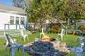Fenced backyard featuring a patio area and an outdoor fire pit