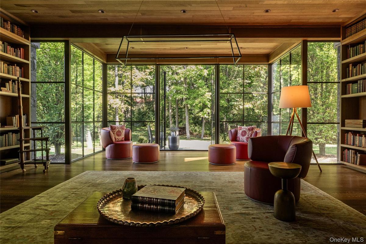 featuring expansive windows and wood ceiling