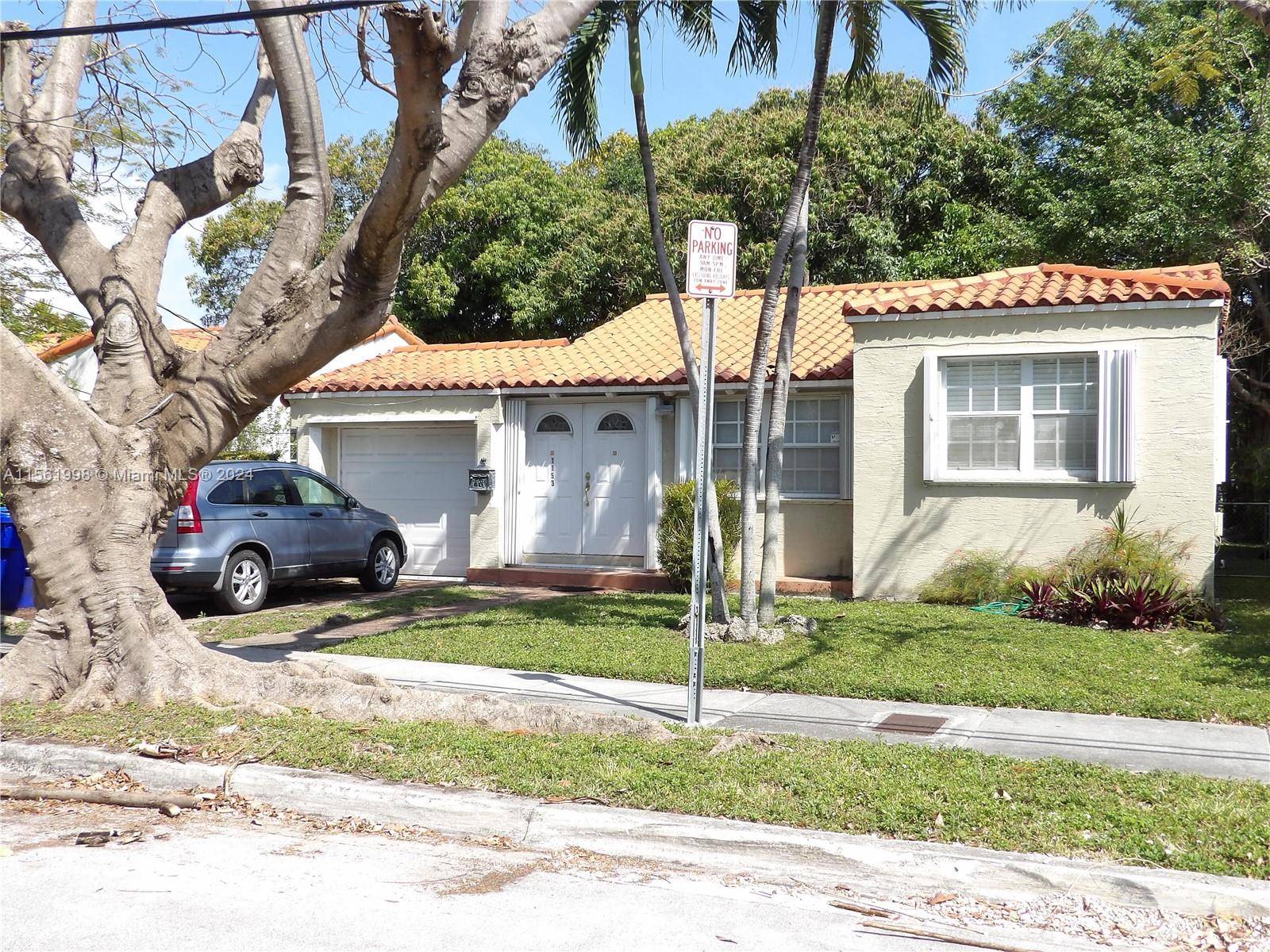 SINGLE FAMILY HOME WITH 2 BEDROOMS 2 BATHS 1 CAR GARAGE, TILED FLOORS, ZONED DUPLEX.