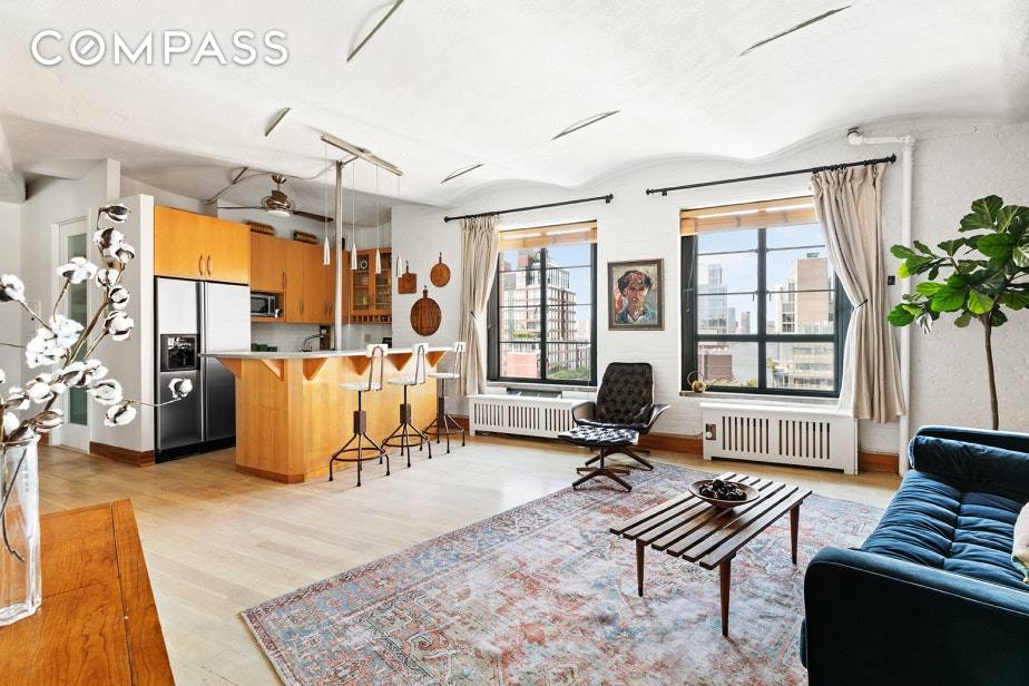 Perched high above the quiet street, this expansive corner 1BR 1BA features soaring barrel vaulted ceilings and oversized casement windows, with views west to the Hudson River and north to ...