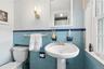 Perfectly located Half bath off the kitchen and back door to the patio