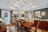 Dining area featuring a coffered ceiling, recessed lighting, and wood-finish flooring