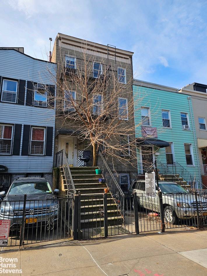 This four story 20 ft wide legal three family townhouse with basement and private parking, sits on a 100 ft deep lot, and will need lots of TLC.