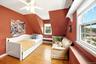 2nd floor Bedroom featuring sloped ceilings, hardwood flooring, and multiple windows