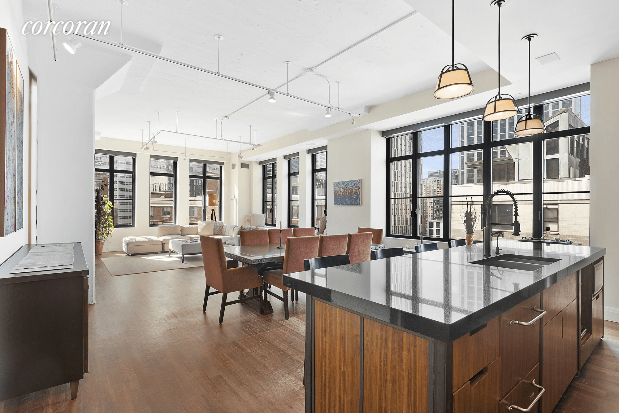 Enjoy endless sunlight and views in this sprawling corner loft featuring 29 windows on four exposures plus a private balcony, a loft rarity, in an outstanding modern Tribeca condominium conversion.