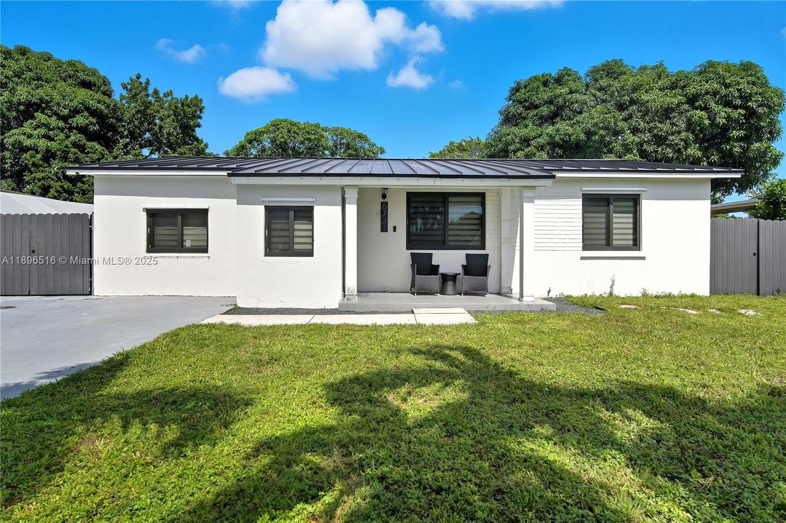 Completely remodeled One Story Single Family Home Featuring a Metal Roof, Covered front porch.