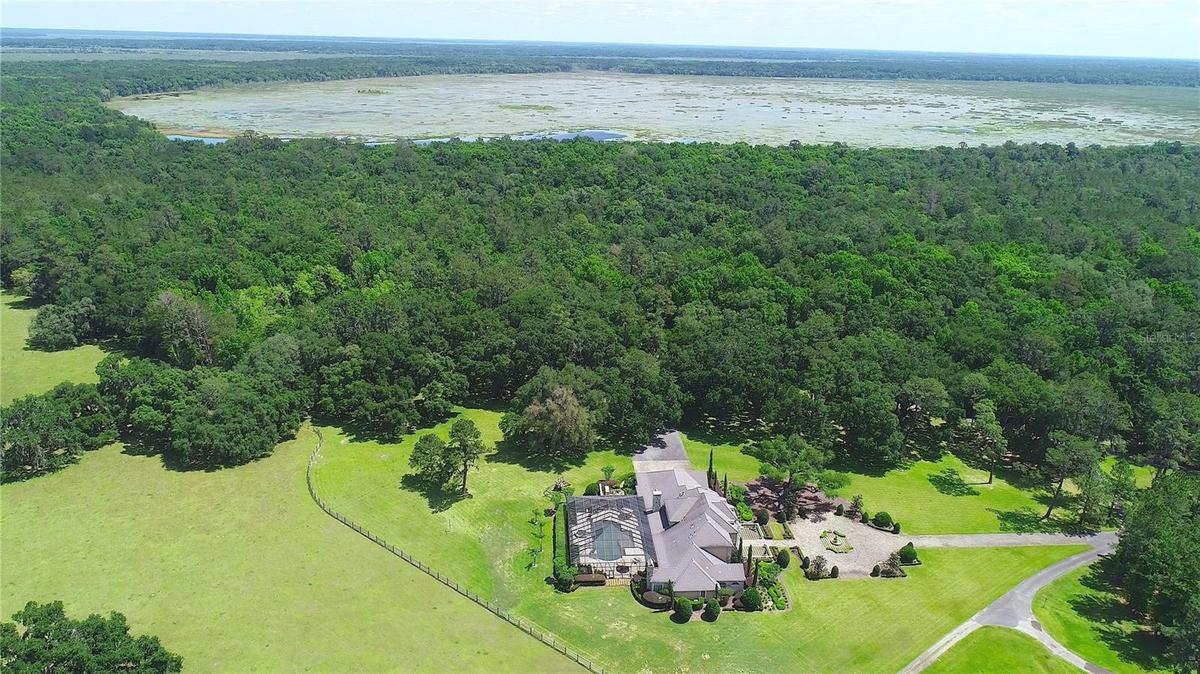 Aerial showing house and lake