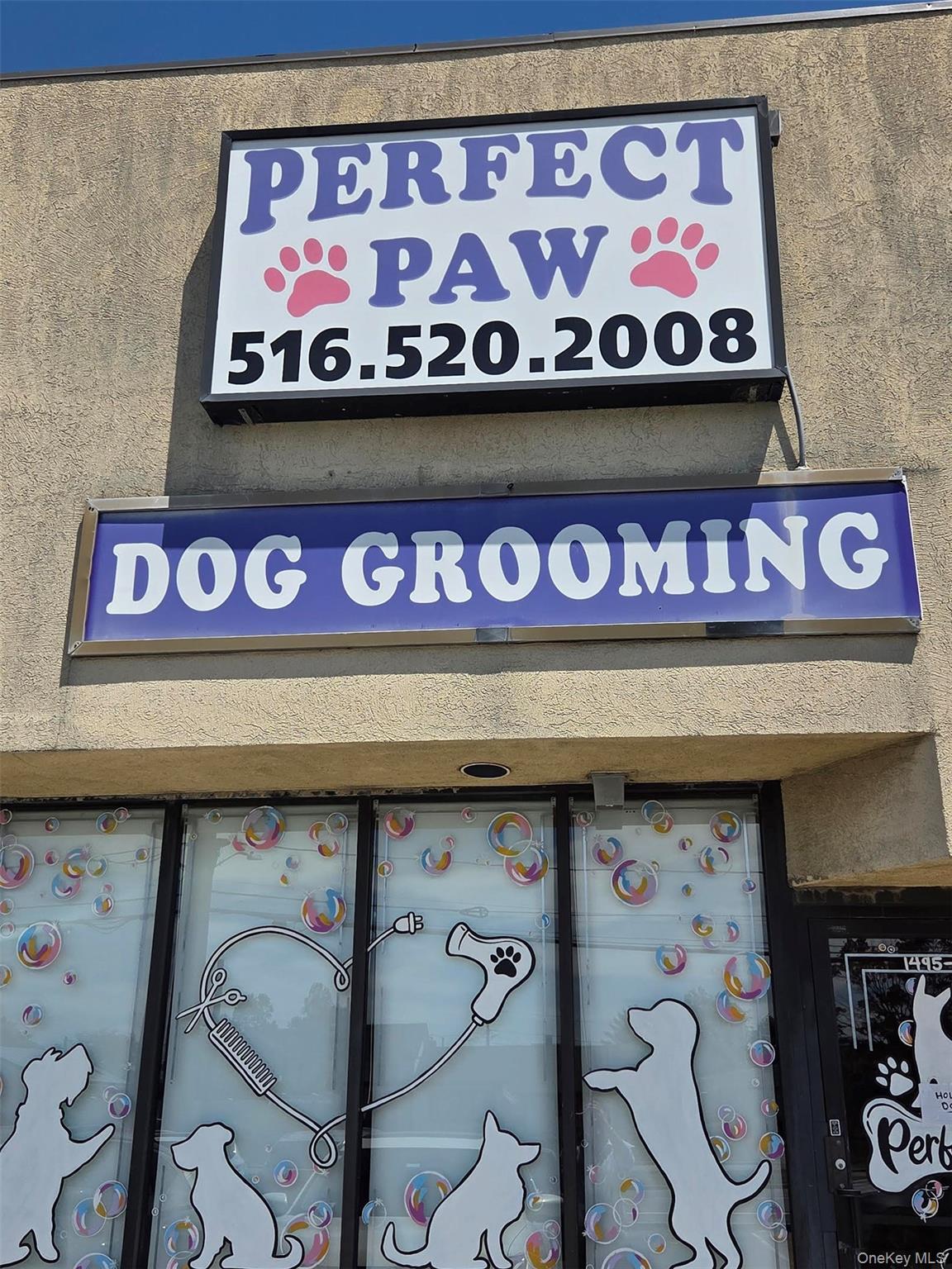 Exterior view of pet washing station and stucco siding