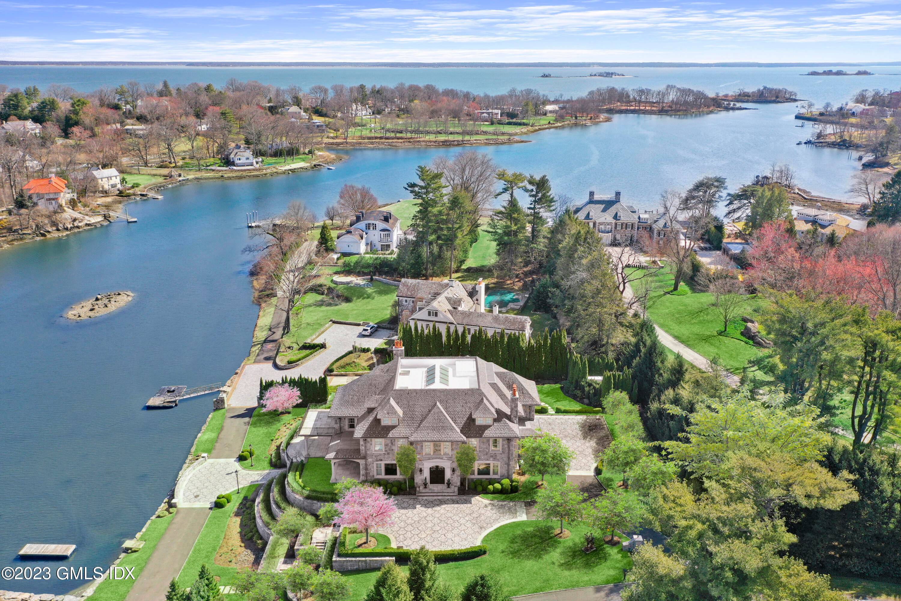 Indulge in the epitome of luxurious living with this exquisite custom built waterfront home, designed by the renowned Ridberg Associates, nestled within the prestigious and secure Indian Harbor Association.