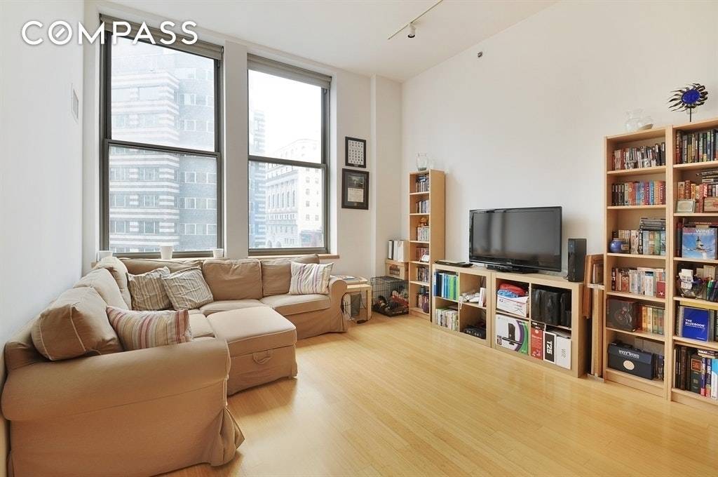 Bright 1 bed with oversized windows, 12' ceilings, bamboo floors and great closet space.