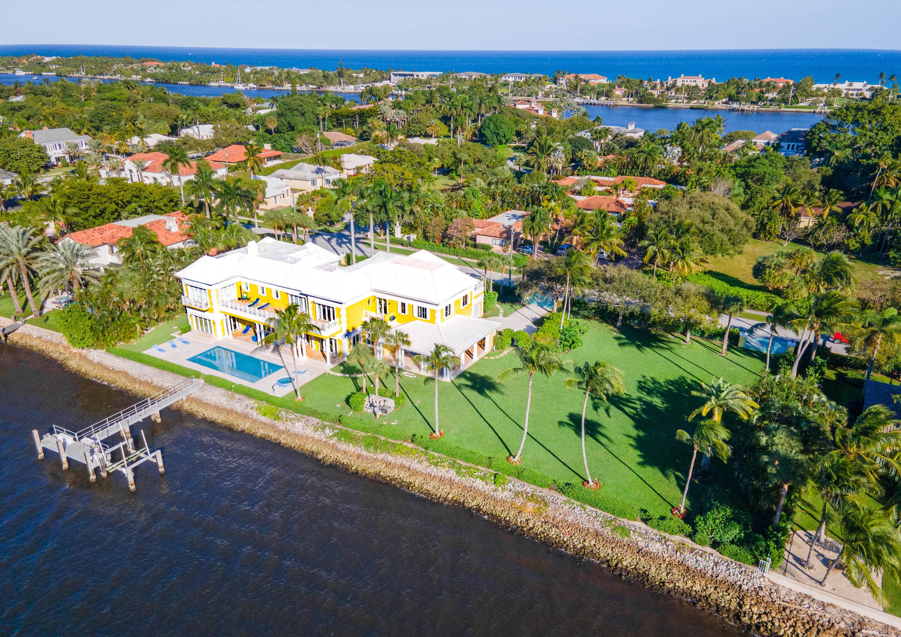 Majestic Manalapan lakefront, 12, 828 sq ft, 282 ft of deep water frontage providing dockage for a super yacht situated on 1.