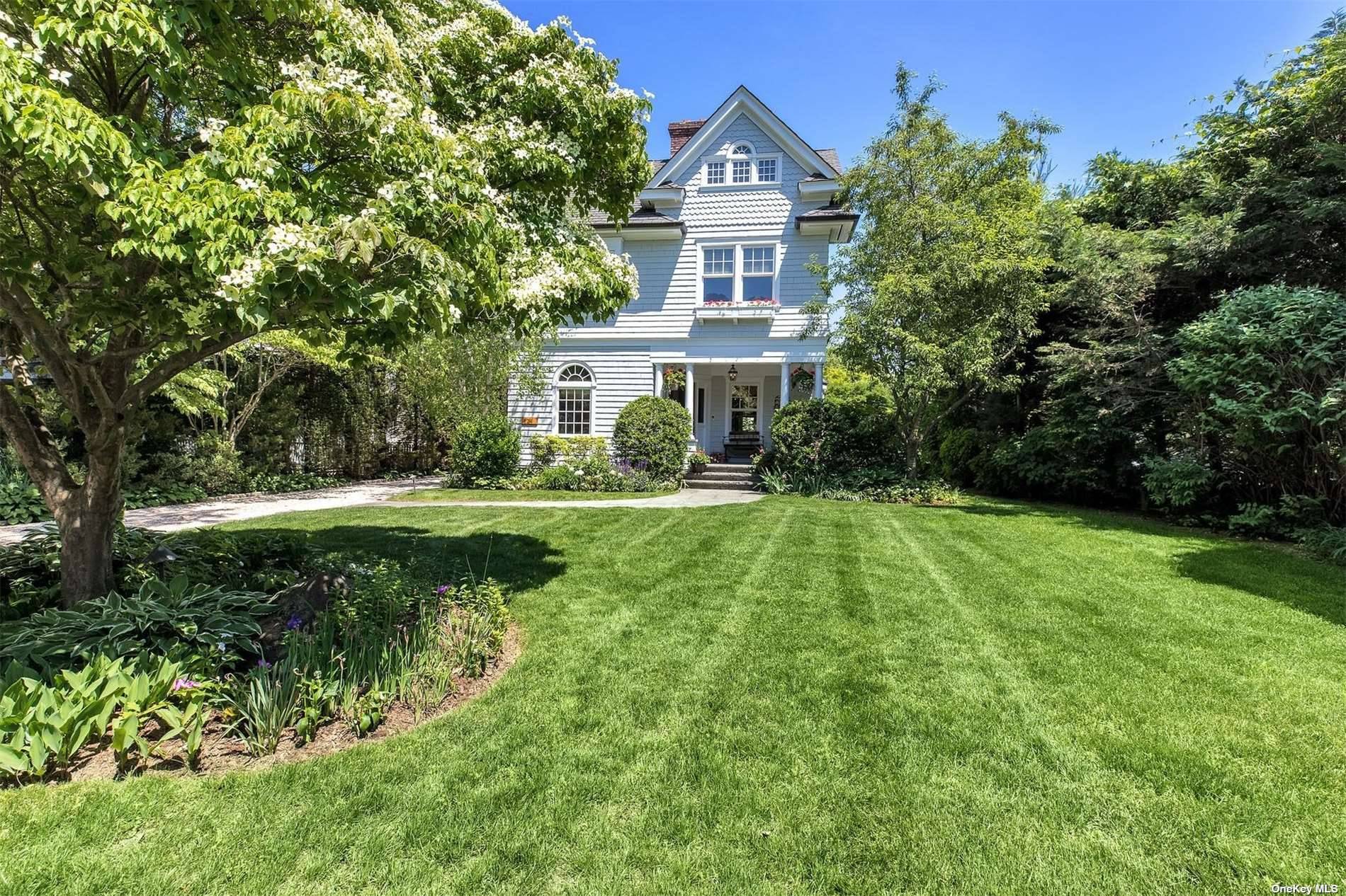 This 5 bedroom, 4. 5 bath Plandome colonial has been masterfully gut renovated and expanded in 2006 offering beautiful bespoke architectural details.