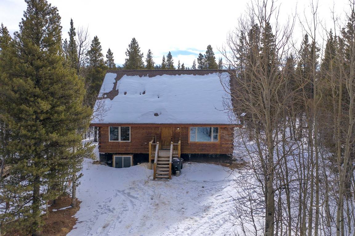 This cedar log home is in turnkey condition with an entirely new lower level, new carpet throughout and even new windows.