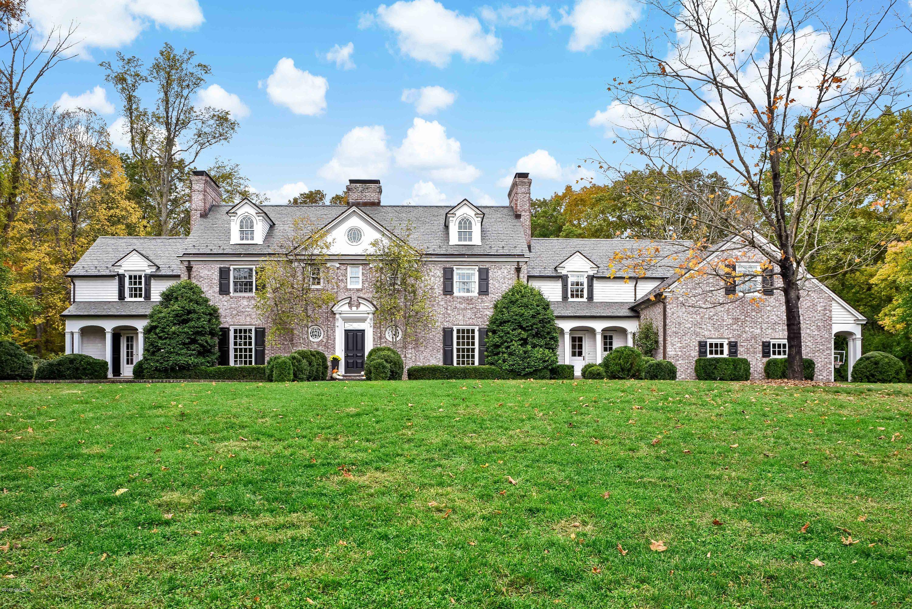 Located on one of New Canaan's most desirable West side streets is this beautiful brick Georgian colonial blending today's modern amenities with the charm and character of yesteryear.