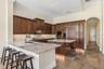 Gourmet Chef’s Kitchen & Dinette (28x13)Taj Mahal Granite Counter42” Custom Maple Cabinets with Rope Column Crown Molding & Trim