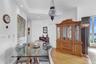 Dining room with light wood finished floors and recessed lighting