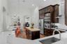 Kitchen sink area overlooks the main living and entertaining spaces.