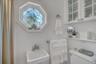 Full Bathroom located adjacent to the laundry room. For added convenience