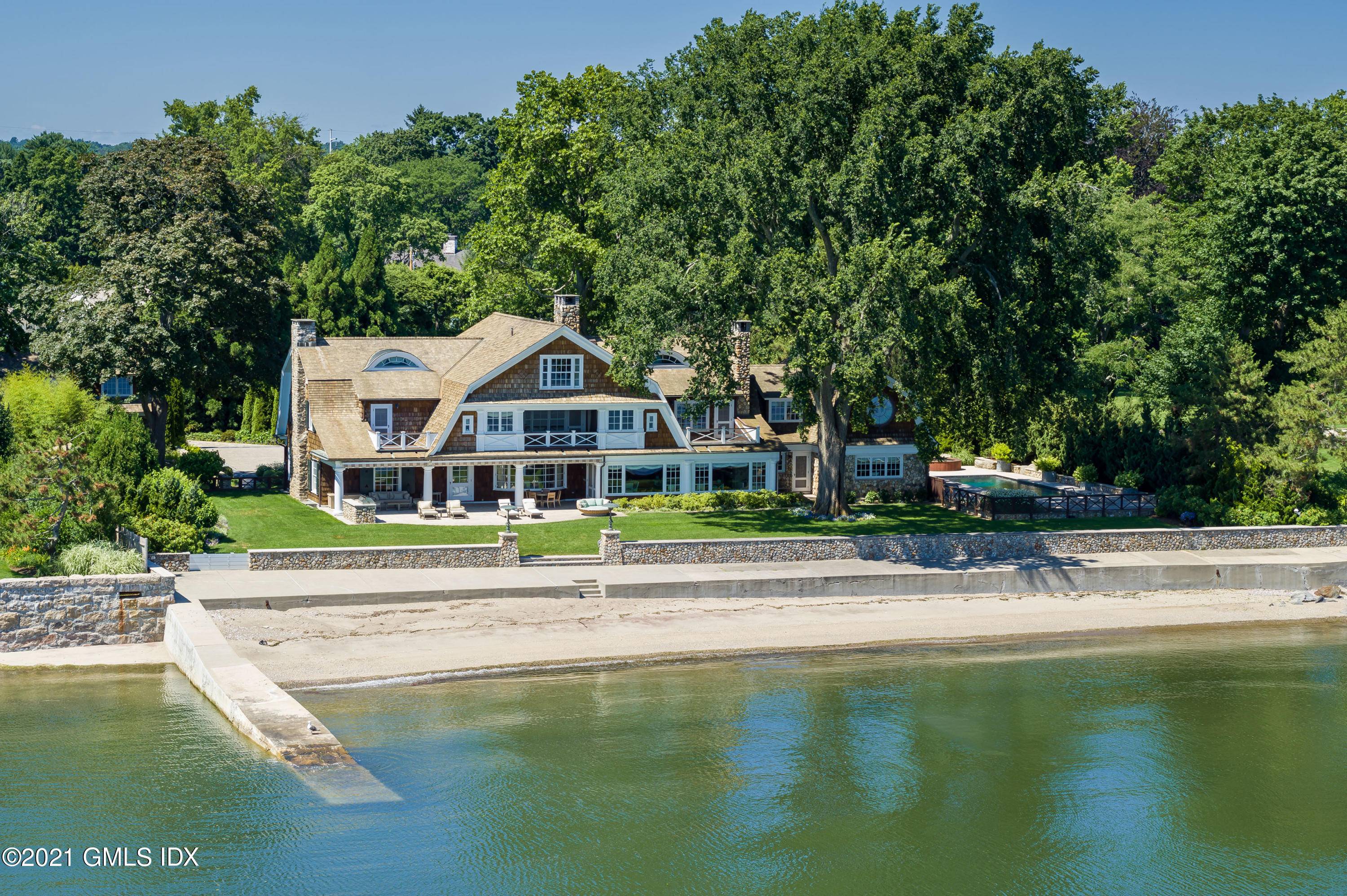 With a sensational location directly on Long Island Sound, this spectacular 1.