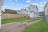 Back of property with a fenced backyard and a residential view