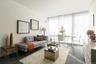 Living room with floor to ceiling windows and a wealth of natural light