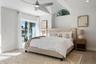 Primary bedroom with sliding doors to the outside patio
